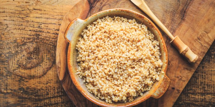healthy colorful cooked quinoa superfood, gluten-free food on wooden background