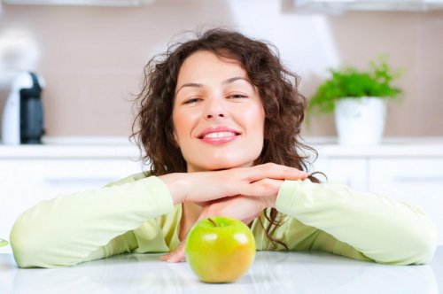 dieting concept healthy food young woman eats fresh fruit