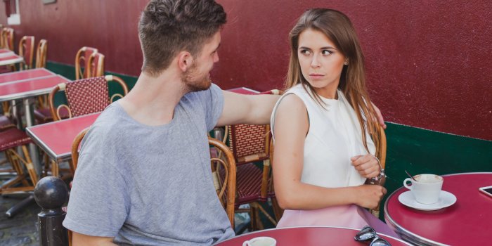 woman rejecting hugs of man, unhappy girl with annoying boyfriend