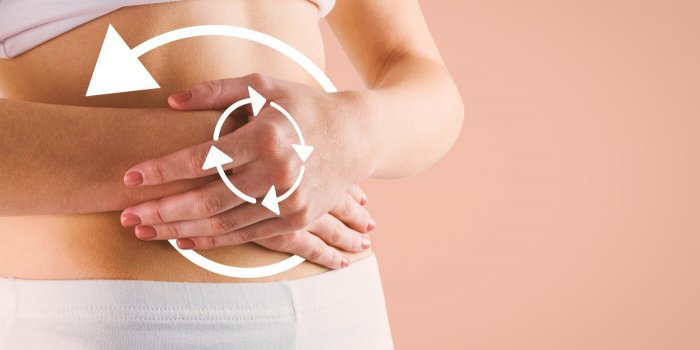 composite image of slim woman touching her belly