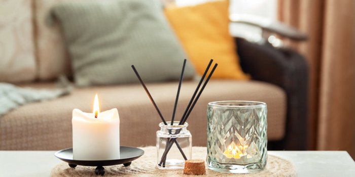 scented candles and aroma incense sticks on table in living room aromatherapy, home fragrance concept of home relaxation ...