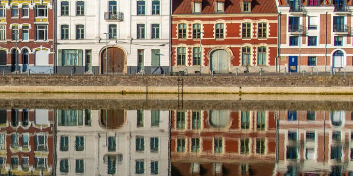 houses reflected in water in lille september