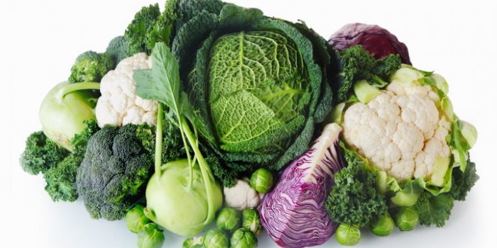 close up healthy fresh farm vegetables isolated on white background emphasizing cabbage, broccoli, cauliflower and brusse...