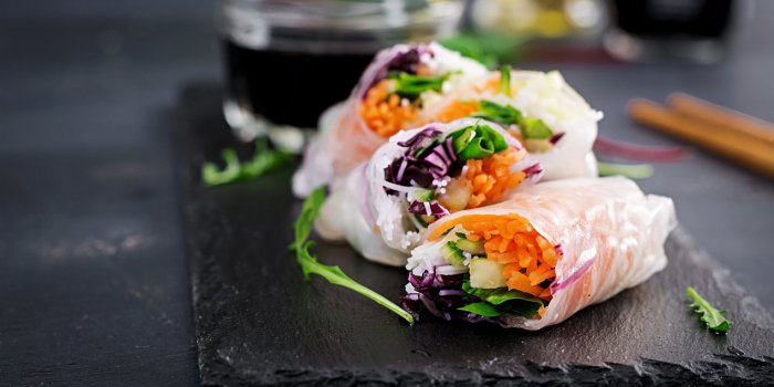 vegetarian vietnamese spring rolls with spicy sauce, carrot, cucumber, red cabbage and rice noodle vegan food tasty meal ...
