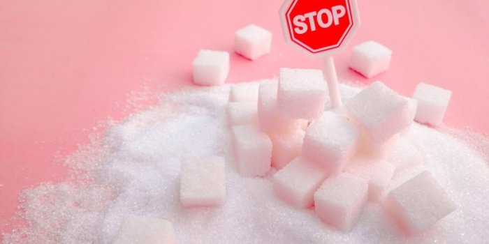 stop sign on the sugar, warned that the sugar too much will make unhealthy nutrition, obesity, diabetes, dental care and ...
