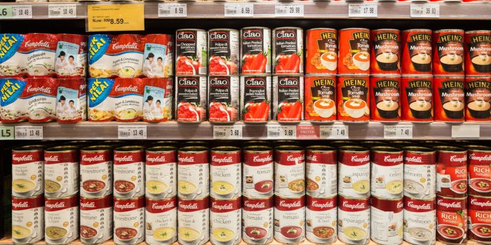 kuala lumpur, malaysia - december 22, 2017 canned soups, from cambell's or heinz among others, are displayed in a superm...