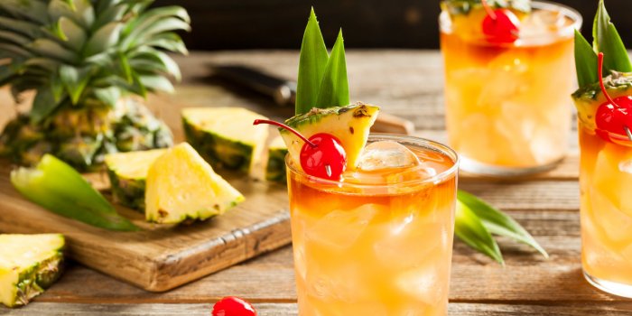 homemade mai tai cocktail with pineapple cherry and rum
