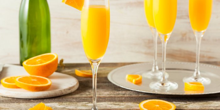 homemade refreshing orange mimosa cocktails with champaigne