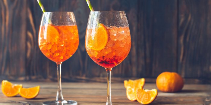 glasses of spritz cocktail on the rustic background