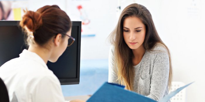 picture of adult woman having a visit at female doctor's office