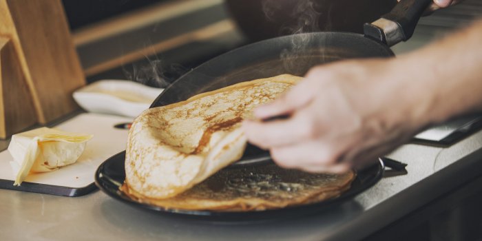 the process of cooking pancakes on a hot skillet