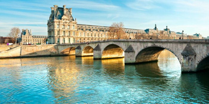 pont royal and louvre museum in paris, france