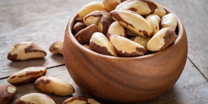 brazil nuts in wooden bowl