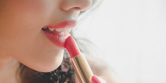 close up beautiful luxury young woman applying lip liner to nude red lips close up shot and make up cosmetic of woman put...