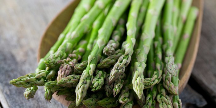 asparagus on wooden surface