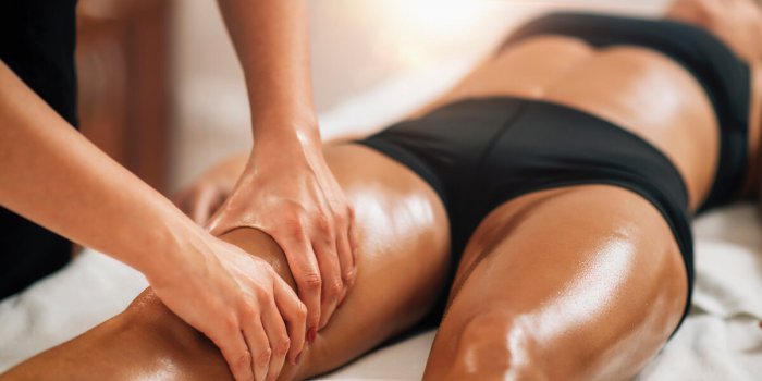 anti cellulite female thigh massage at a beauty spa salon body care concept
