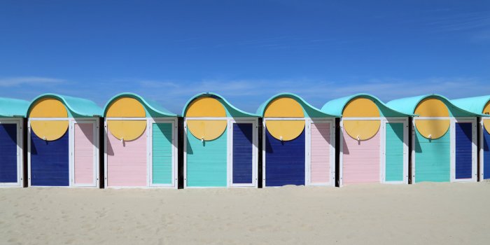 colored beach cabins on dunkirk beach in france