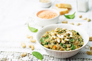 lentils mushroom spinach quinoa with fresh spinach leaves and cashews toning selective focus
