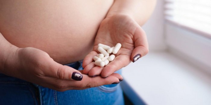 overweight woman doubting to take slimming pills weight losing, pharmacy concept