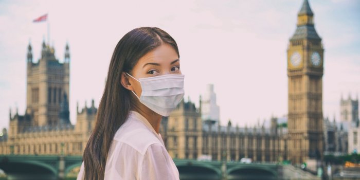 corona virus travel corona virus spread prevention asian woman tourist wearing protective face mask on uk london city sig...