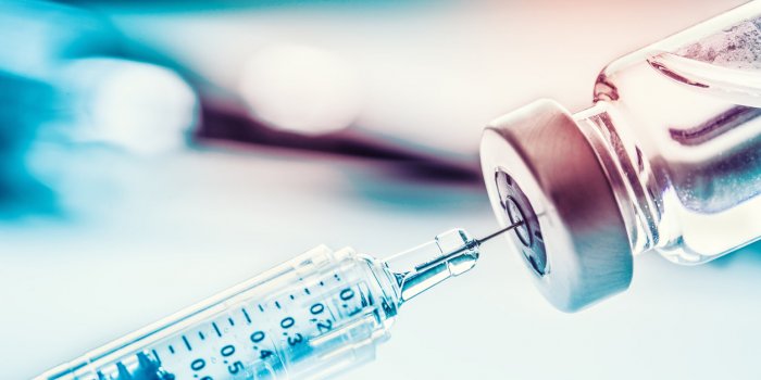 close-up medical syringe with a vaccine