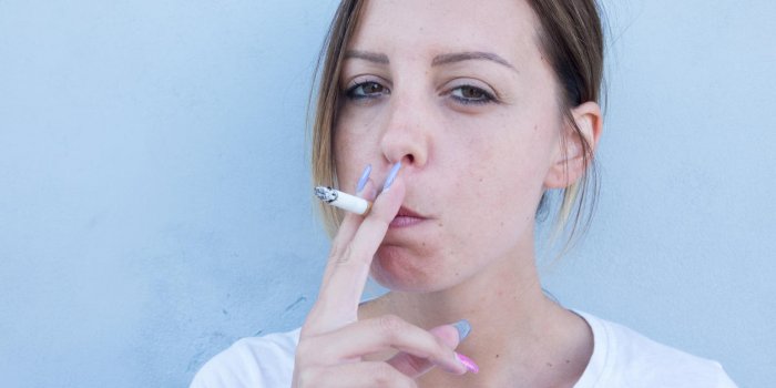 girl smokes the cigarette with so many health problems