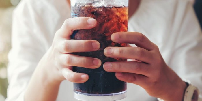 woman hand giving glass ,soft drinks with ice, sweethart or buddy