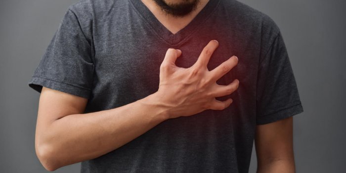 asian beard man in gray shirt having chest pain from heart attack on grey background illness, exhausted, disease, tired f...