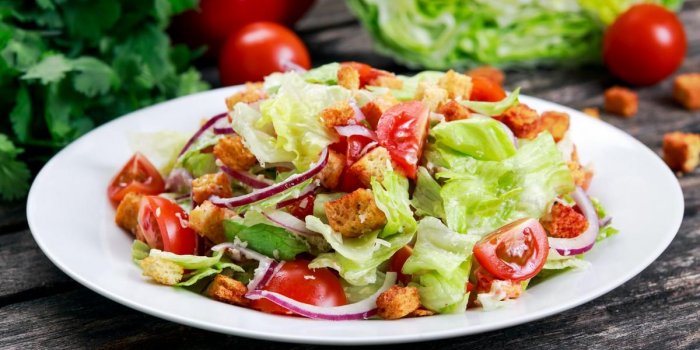 fresh healthy classic caesar salad on plate