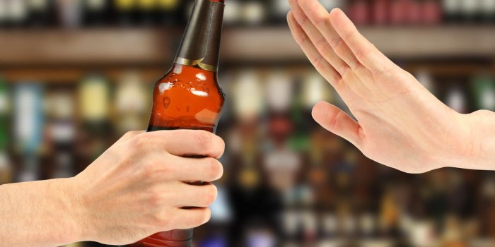hand reject a bottle of beer in the bar (both images are my property)