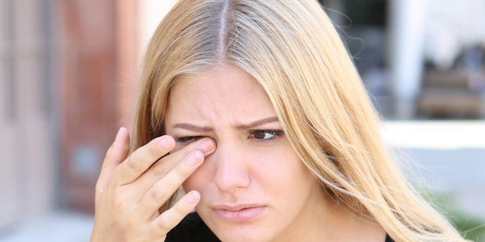 woman with eye problems outside