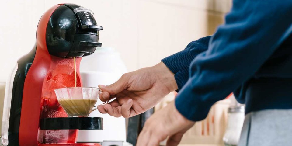 man making coffee with coffee maker