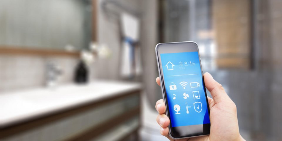 mobile phone with apps on smart home in modern bathroom