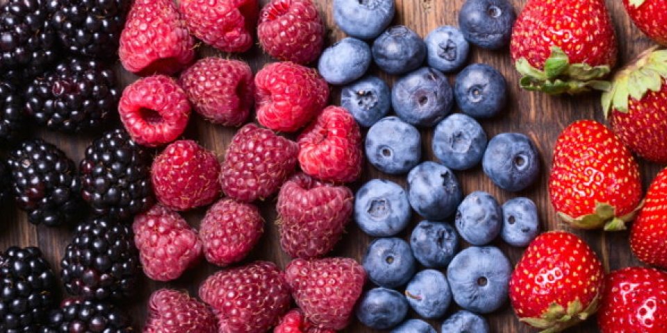 berries (strawberry , raspberry , blueberries & blackberries ) on wooden background