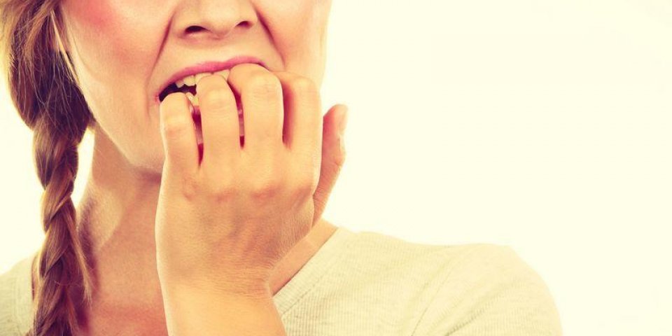 stress, anxiety, emotions and problems concept scared, stressed woman biting her nails