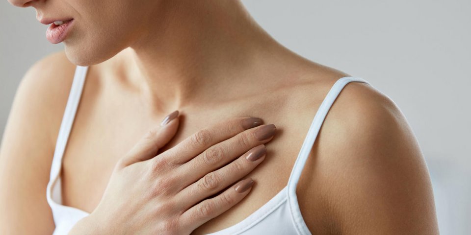 heart health care closeup of young woman feeling strong pain in chest close-up of female body with hand on chest girl suf...
