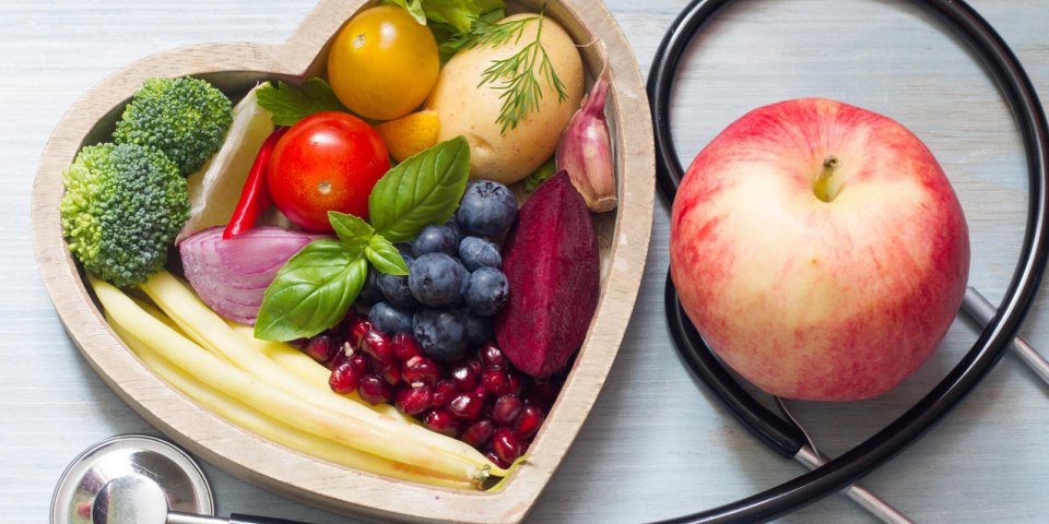 healthy food in heart diet concept with stethoscope closeup