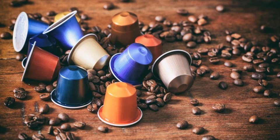 colorful espresso coffee capsules on wooden background