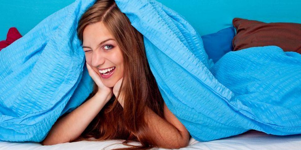 bedtime 29 girl laughing in bed