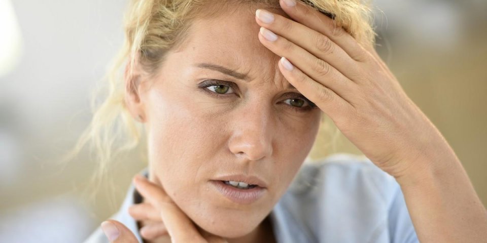 middle-aged woman suffering headache