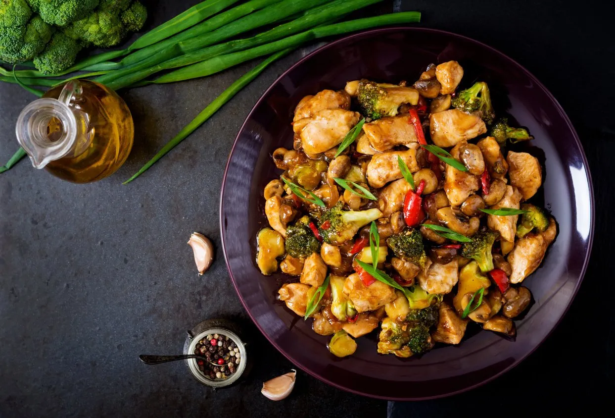 stir fry with chicken, mushrooms, broccoli and peppers - chinese food top view