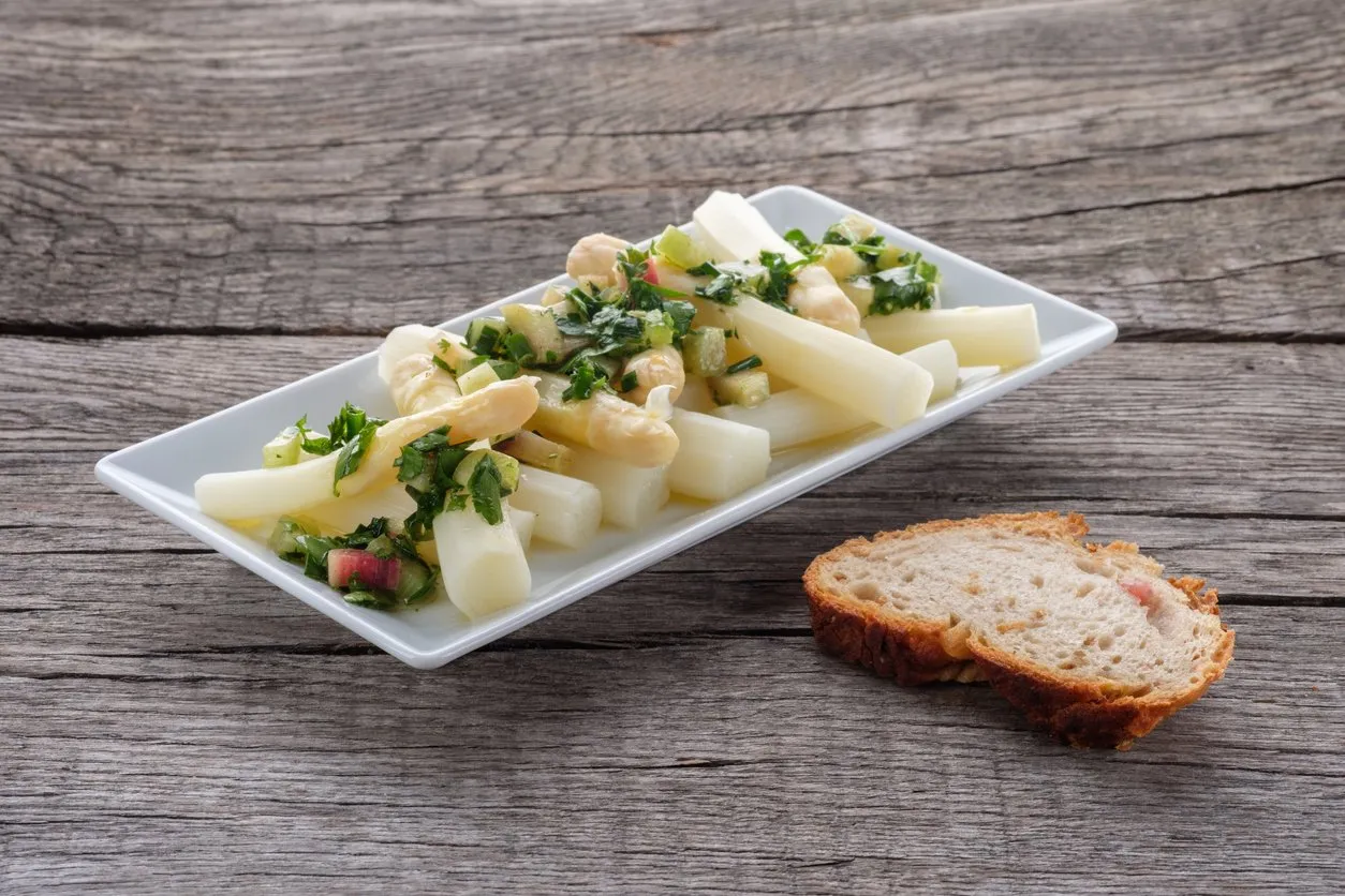 salad with white asparagus and rhubarb sauce with herbs