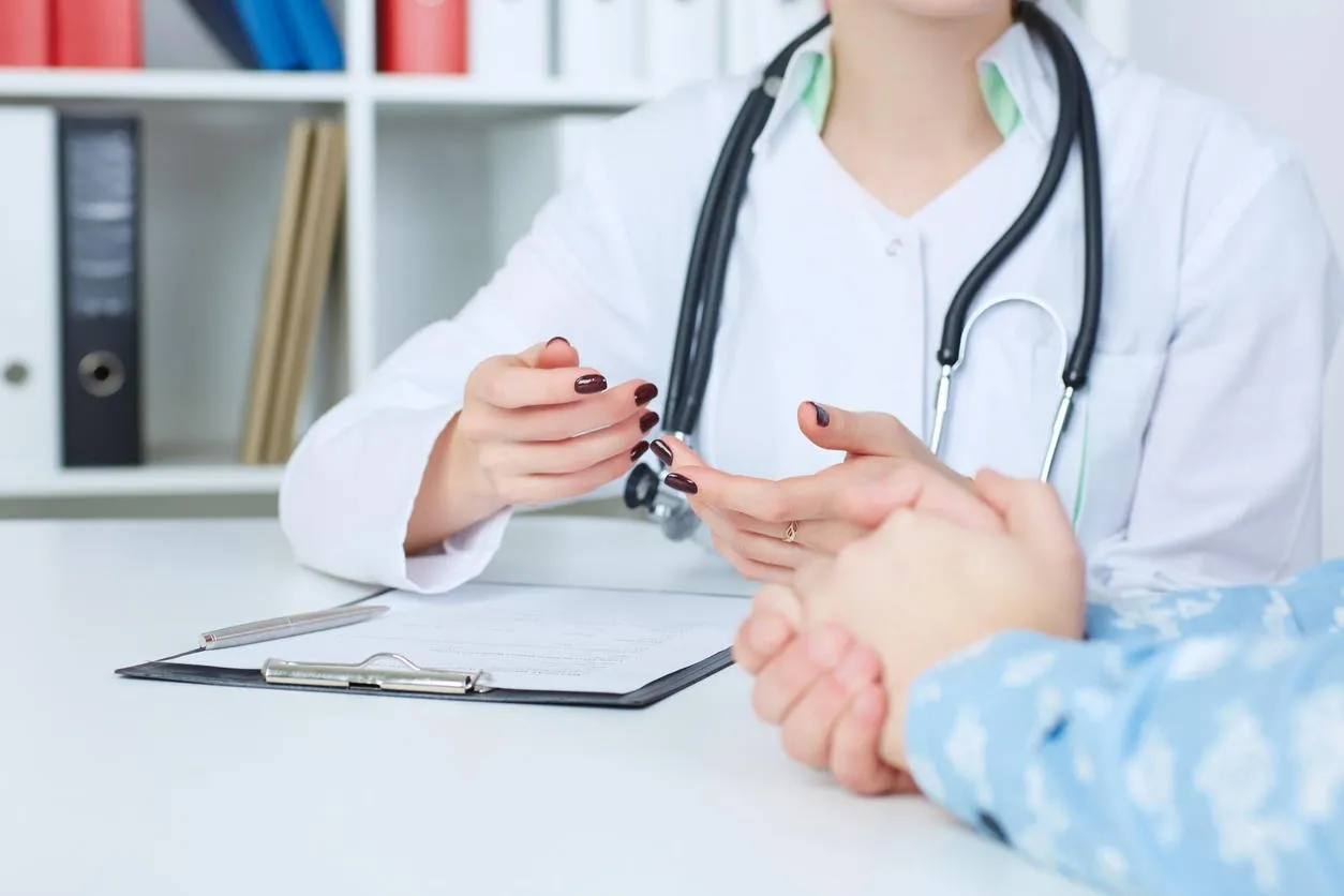 doctor and patient are discussing something, just hands at the table