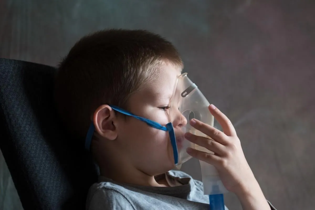 medical procedures inhaler the caucasian blonde inhales couples containing medication to stop coughing the concept of home treatment