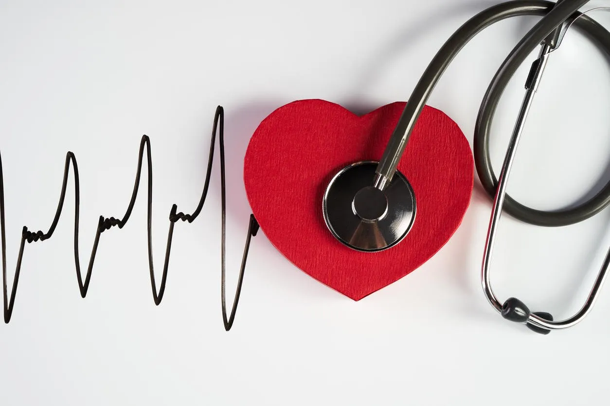 medical stethoscope and red heart with cardiogram isolated on white cardiac therapeutics assistance, pulse beat measure document, arrhythmia pacemaker medical healthcare concept