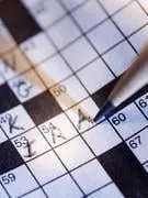 mots croisés et un crayon