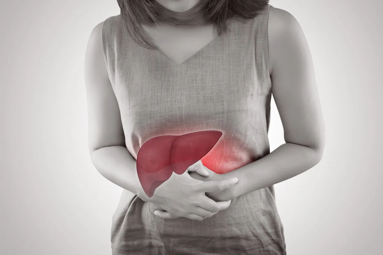 the photo of liver on woman's body against gray background, hepatitis, concept with healthcare and medicine