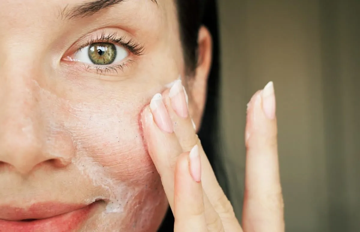 purification of the face girl washed with scrub to clean the pores