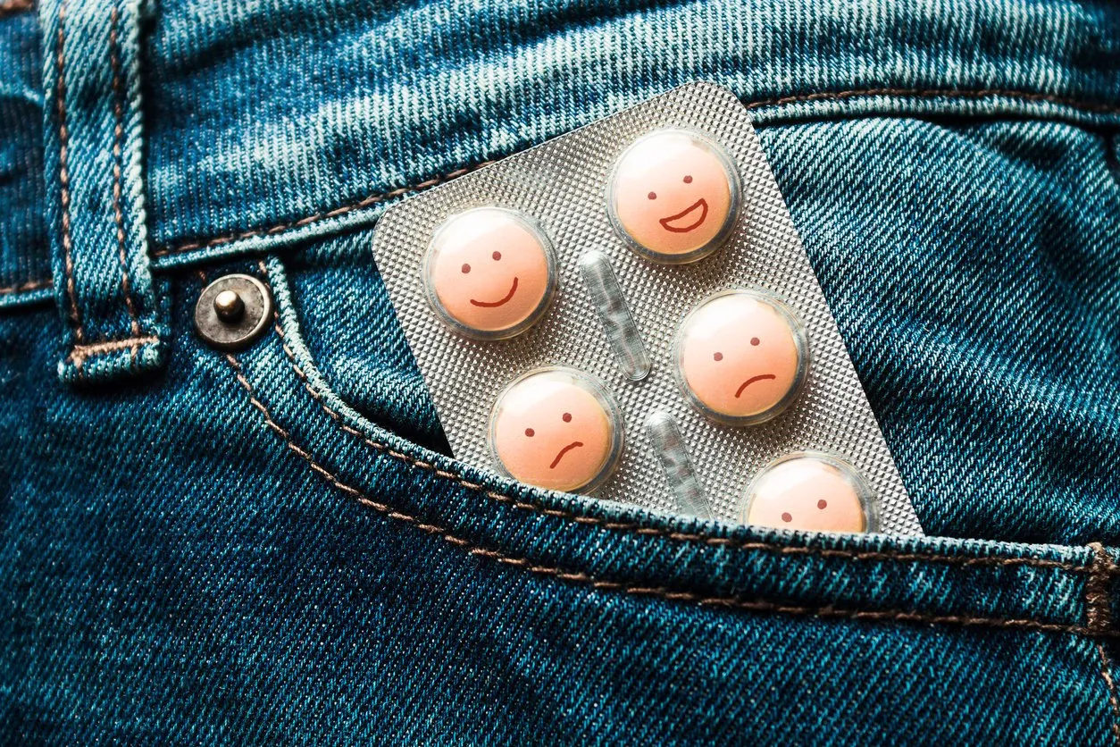 pills in the jeans pocket concept of antidepressants