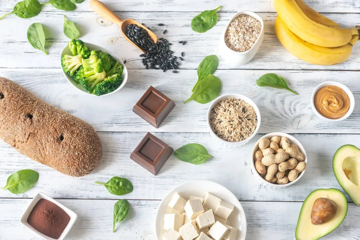 assortment of magnesium-rich foods on the wooden background